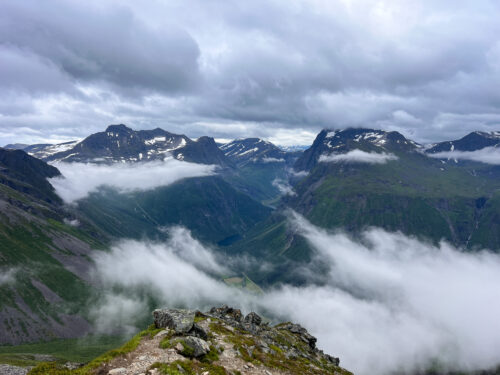 Mountain peaks rising above a sea of cloud.