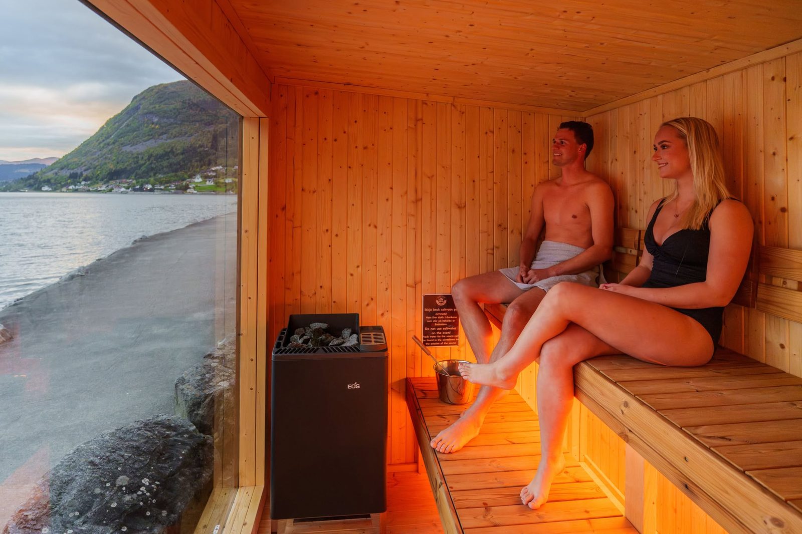 Inside Badestova with the fjord view Inside the Badestova sauna, with the fjord through the window