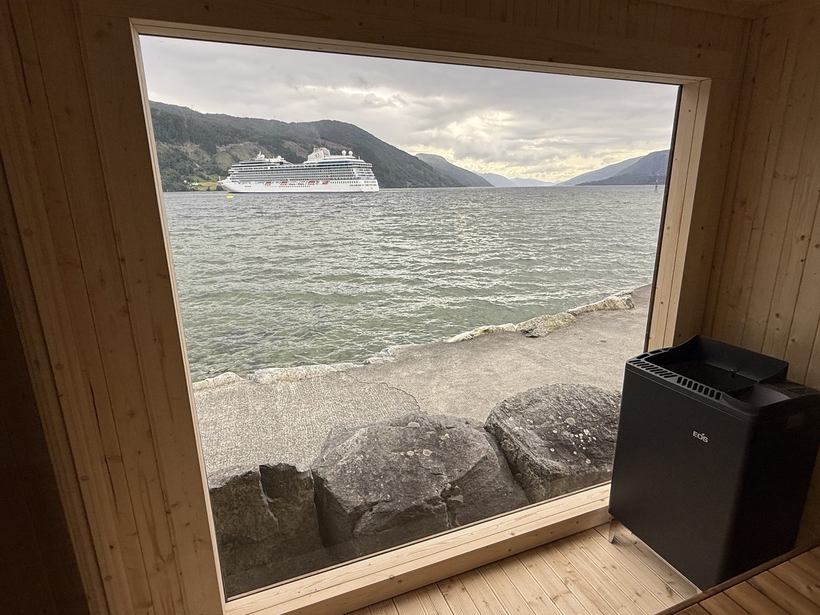 Badestova sauna window with a cruise ship Looking out through the big sauna window at Badestova towards a cruise ship on the fjord