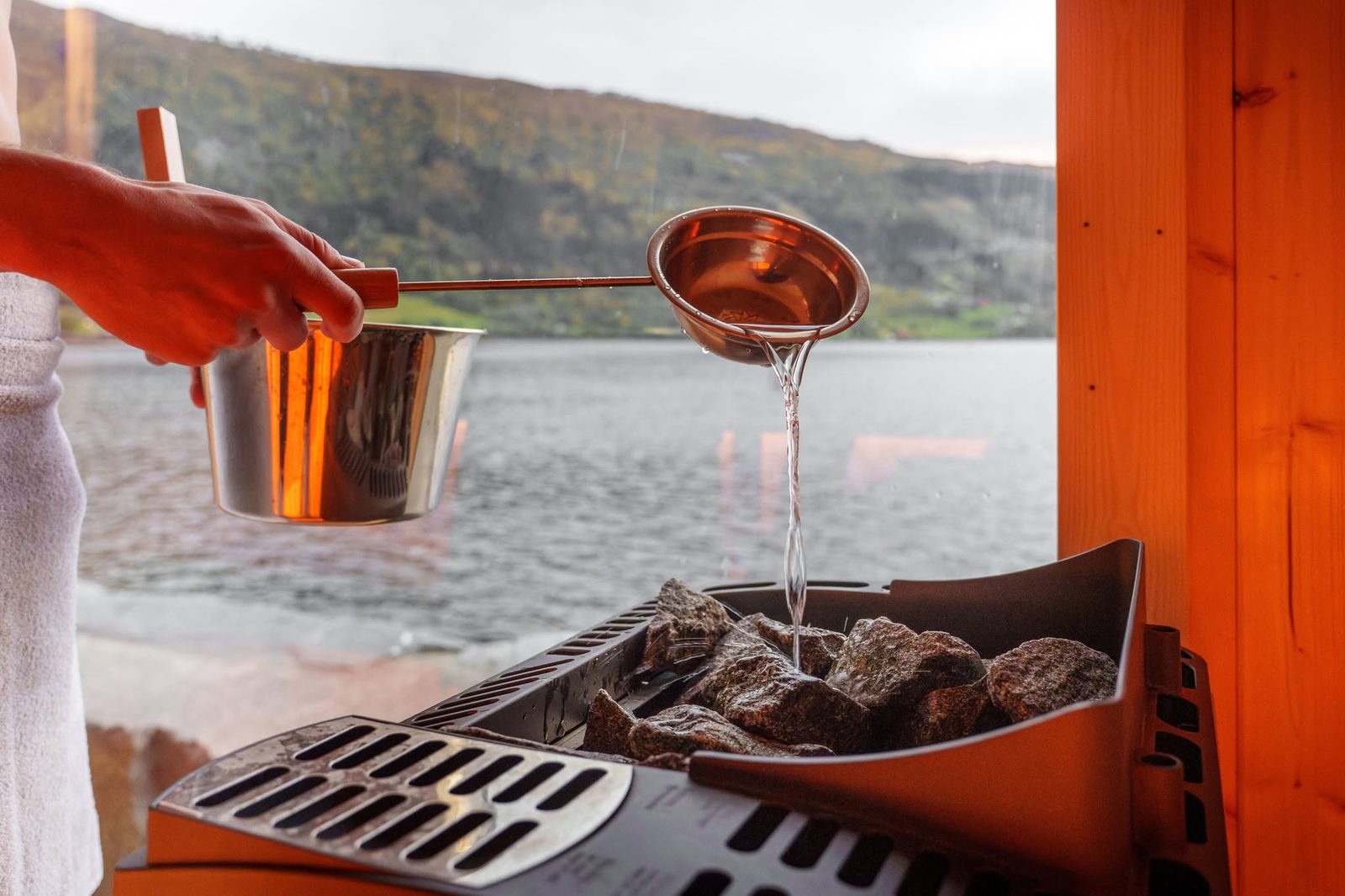 Water poured on the hot stones of the sauna stove at Badestova