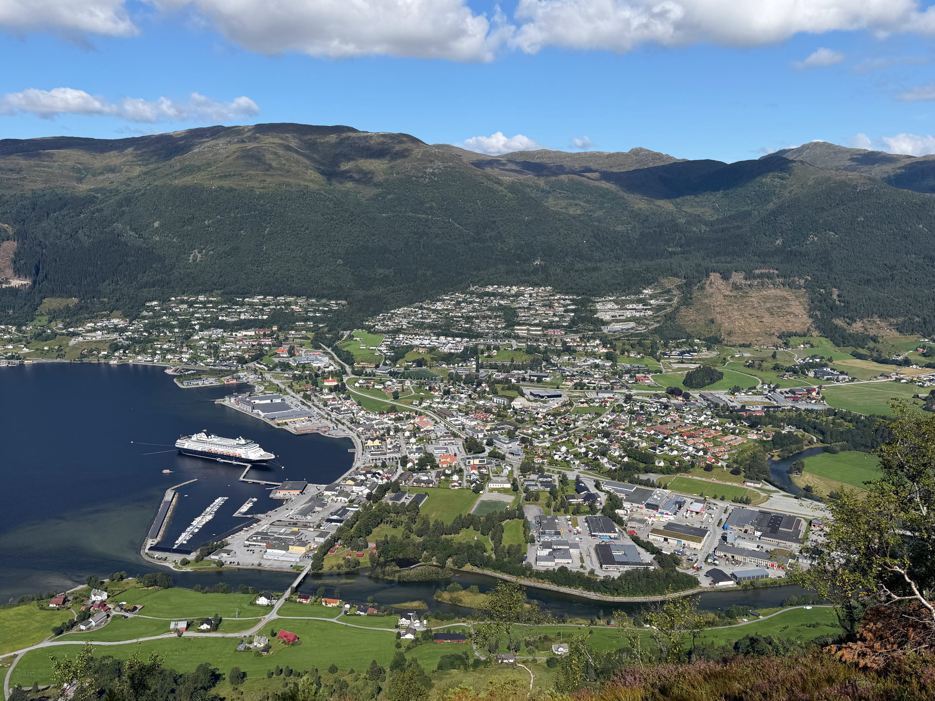 Nordfjordeid seen from the ridge above the village: the cruise pier, the town and the fjord
